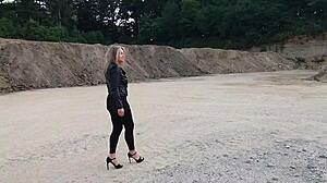 grandma walks gravel pit in tight leggings and heels