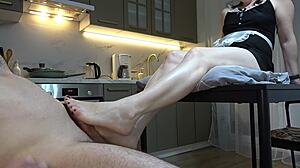 maid gives footjob until he cums hard