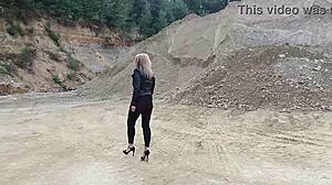 grandma walks gravel pit in tight leggings and heels