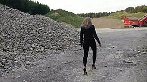 grandma walks gravel pit in tight leggings and heels