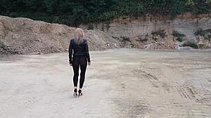 grandma walks gravel pit in tight leggings and heels