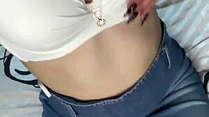 beautiful girl touches herself under skirt while moaning softly