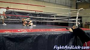 Muscular women wrestling in a boxing ring
