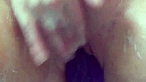 masturbating in the bath with my big purple 12 dildo until i cum