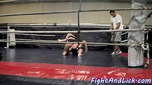 Muscular women wrestling in a boxing ring
