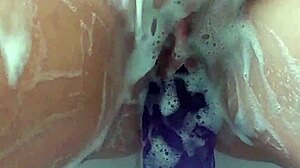 masturbating in the bath with my big purple 12 dildo until i cum